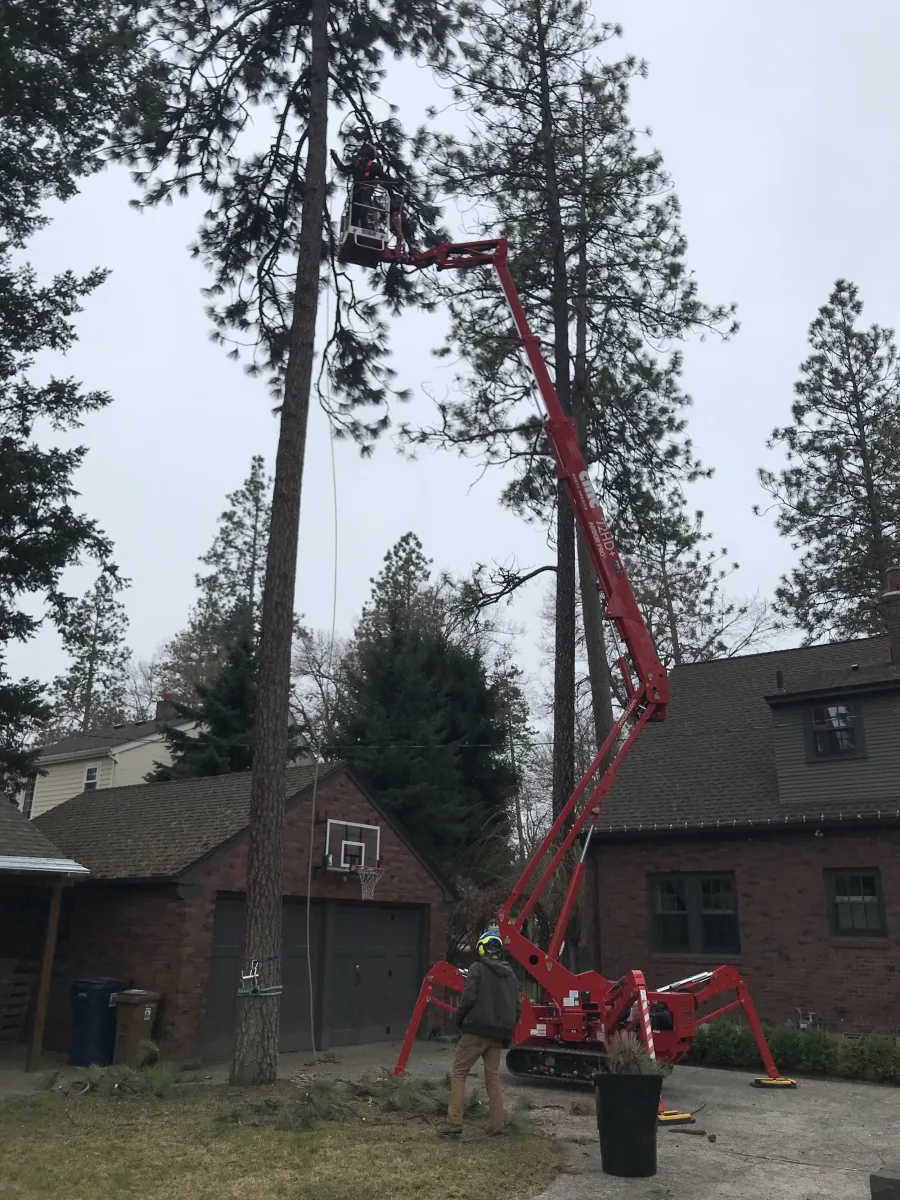 Trailhead's 72-foot spider lift set up beside a Spokane house